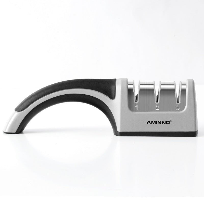 A Four - in - one Family Uses A Sharpener To Sharpen A Kitchen Knife - Asmota