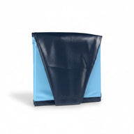 Asmota foldable pet swimming pool in dark blue and light blue PVC, shown in a compact folded storage position.